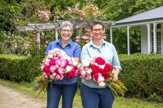 Pure Peony founders at Dove River Peonies with organic peony flowers