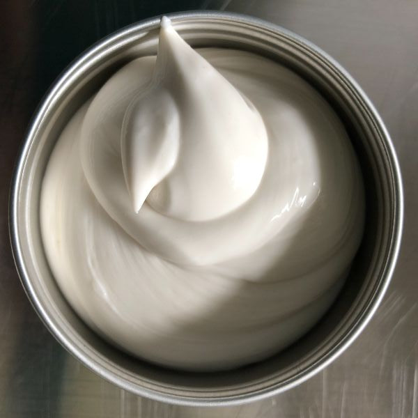 Open tin of Peony After Shower Moisture Lock to lock in hydration