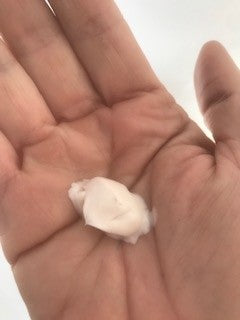 dab of moisturising eczema cream shown in hand
