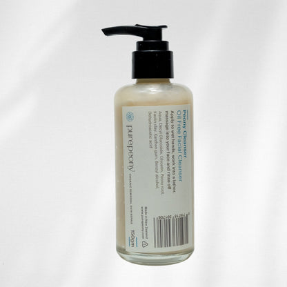 Facial cleanser bottle with pump on a white background