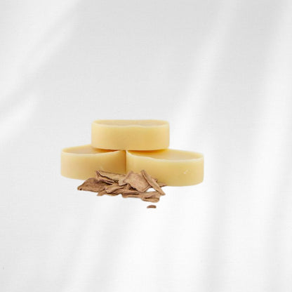 Three hair conditioner bars stacked with the hero ingredient peony root shown