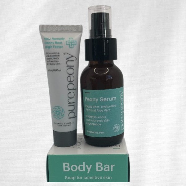 sample size eczema cream peony serum sitting on top of body bar eczema soap box