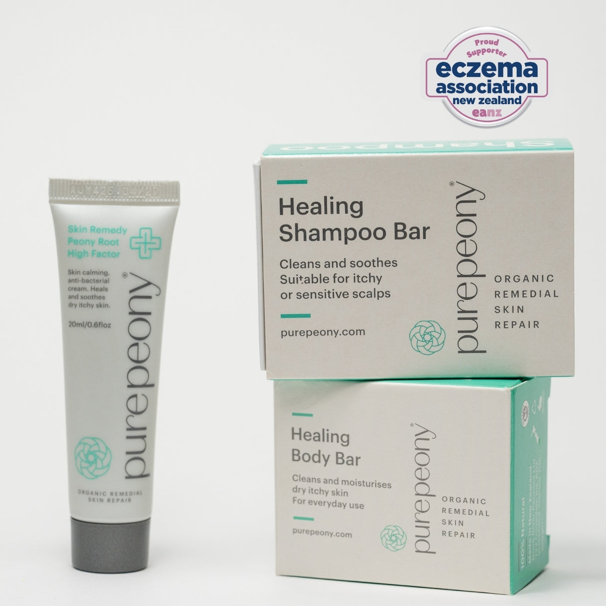 purepeony healing shampoo bar and body bar with packaging on a white background