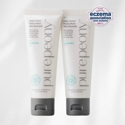 Two sugarcane tubes of purepeony skin remedy on a white background with Eczema Association New Zealand logo.